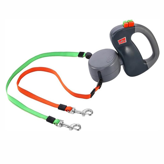 Dual retractable dog leash with green and orange colour-coded leads and ergonomic grey handle with stainless steel swivel clips